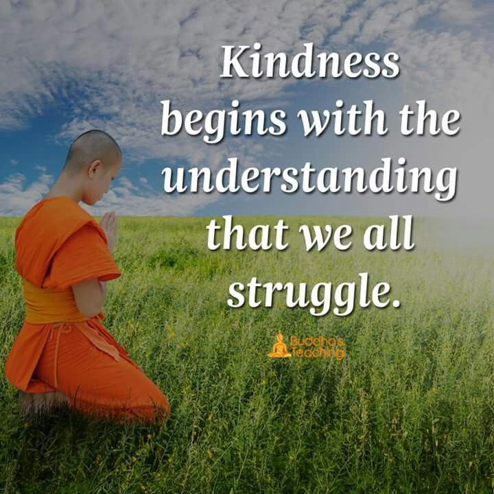 A monk meditating beside a kindness quote