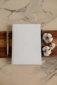 blank notepad with cotton flowers