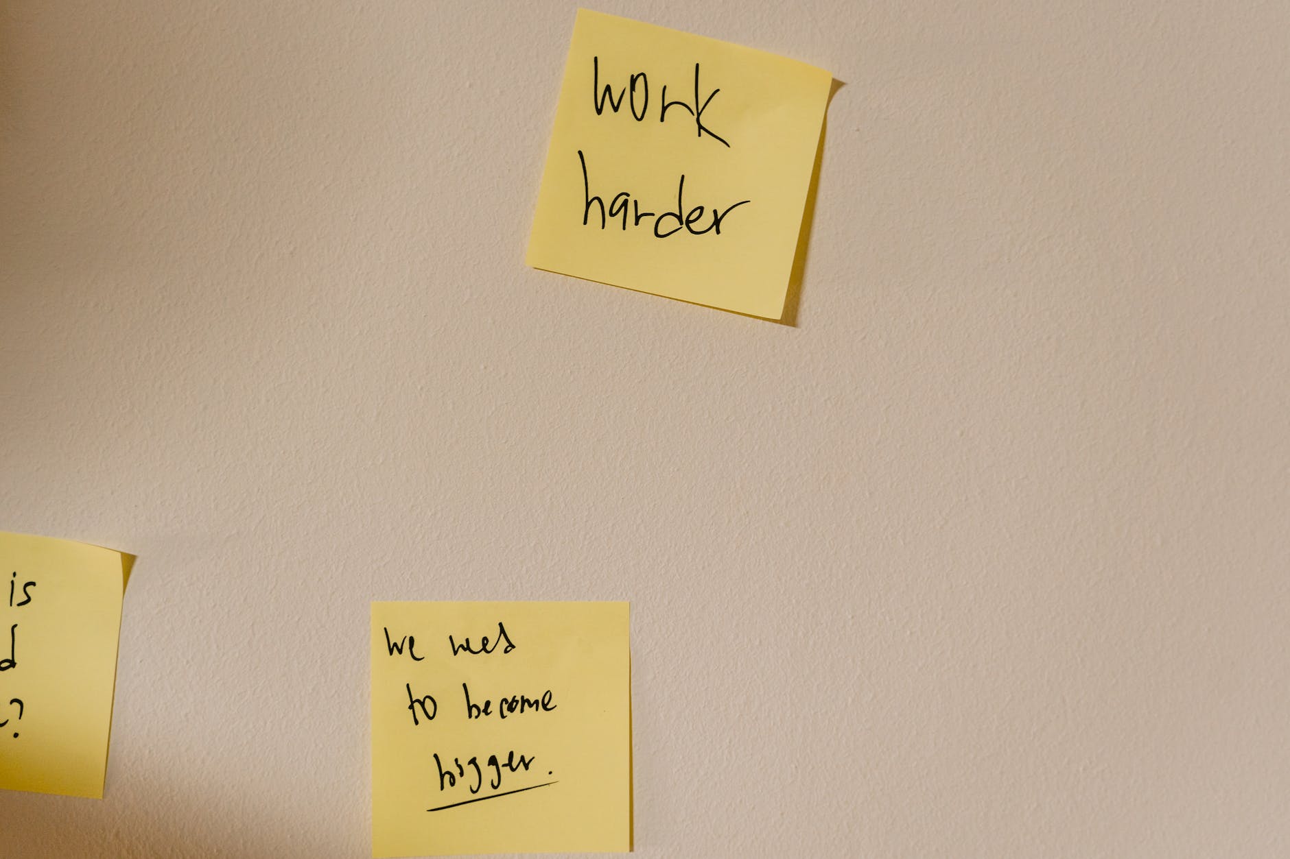 sticky notes with written messages posted on the wall to harness discipline. 